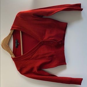 Red cropped sweater.